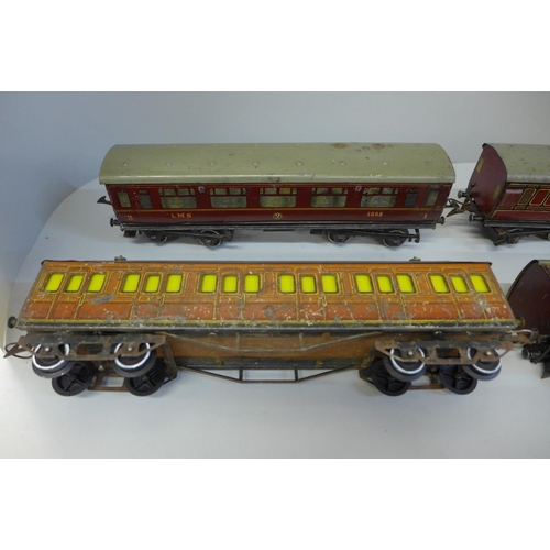 671 - Three Hornby O gauge LMS carriages and one Hornby O gauge Metropolitan carriage