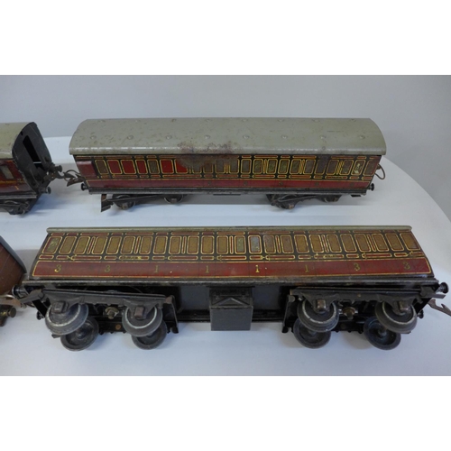 671 - Three Hornby O gauge LMS carriages and one Hornby O gauge Metropolitan carriage