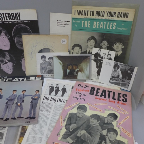 674 - A collection of Beatles ephemera including a souvenir Beatles plate and songbook