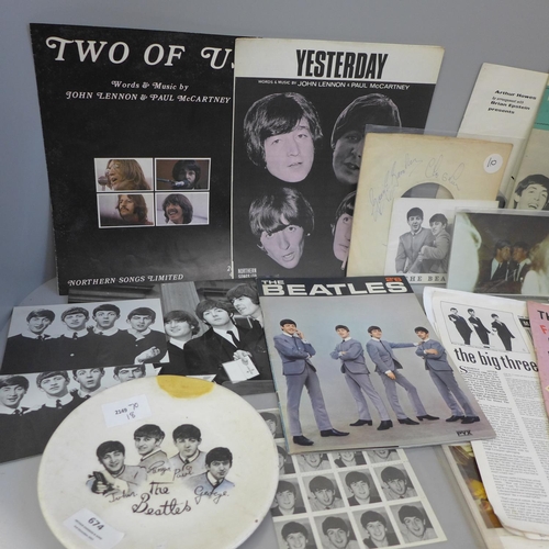 674 - A collection of Beatles ephemera including a souvenir Beatles plate and songbook