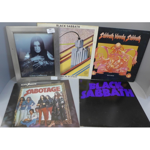 687 - A signed Ozzy Osbourne picture and four Black Sabbath records