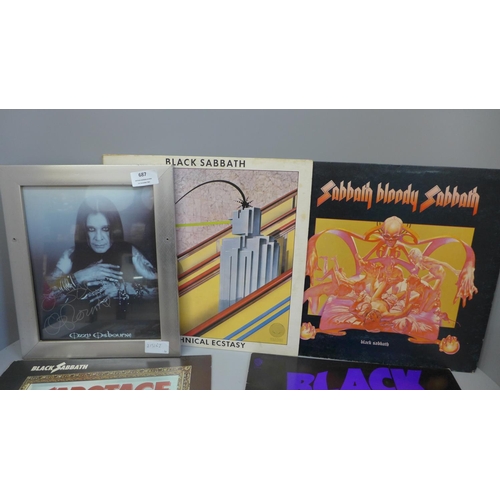 687 - A signed Ozzy Osbourne picture and four Black Sabbath records