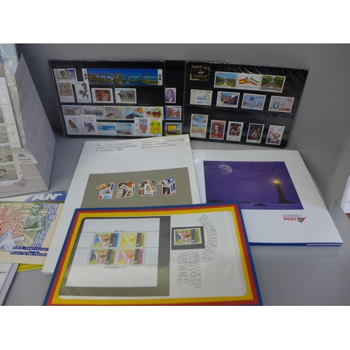 691 - A collection of 15  year books and presentation packs of stamps