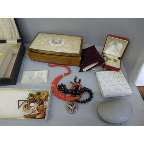 693 - A collection of costume jewellery, a brush and mirror set lacking comb and a storage box