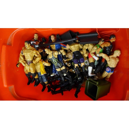 698 - A collection of fifty WWE wrestling figures and ring