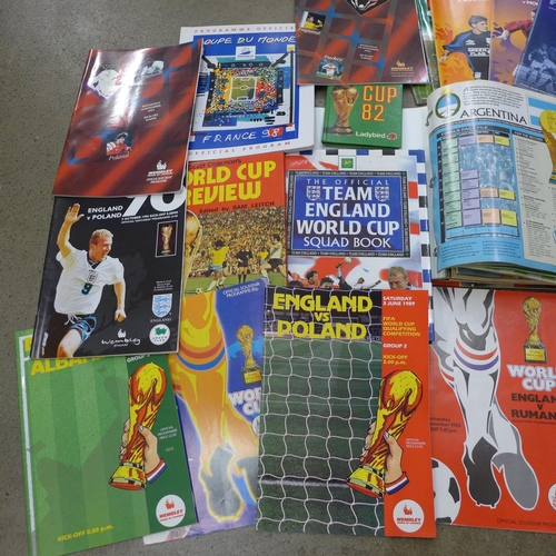 702 - Football memorabilia; a box of World Cup related books and programmes, 1950's onwards includes North... 