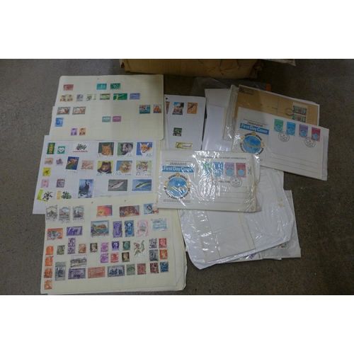 703 - A quantity of stamps, some loose and on stock cards and first day covers