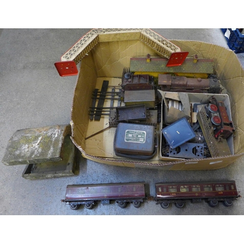 715 - A box of tin plate Hornby O gauge model rail including rolling stock, a bridge, a Royal Scot locomot... 