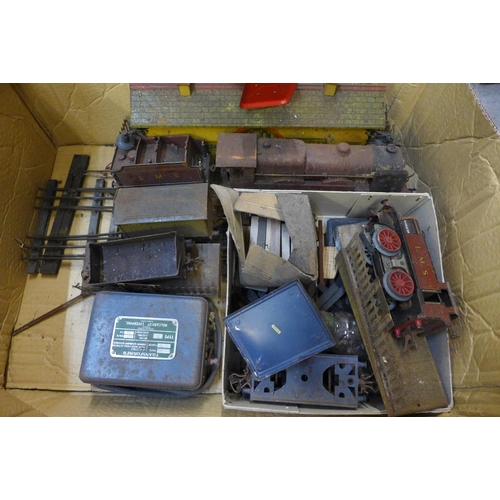 715 - A box of tin plate Hornby O gauge model rail including rolling stock, a bridge, a Royal Scot locomot... 