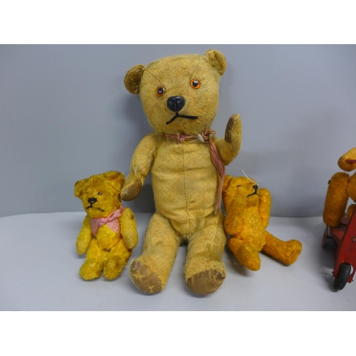 724 - Five vintage small Teddy bears, one on a bike