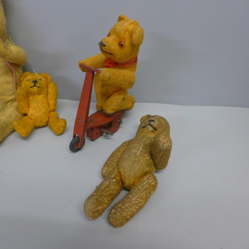 724 - Five vintage small Teddy bears, one on a bike