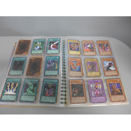 738 - Over 450 1990s Yu-Gi-Oh! cards including holographic and first editions, some in collector's folder ... 