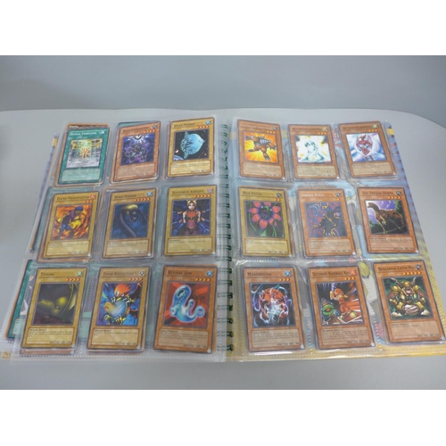 738 - Over 450 1990s Yu-Gi-Oh! cards including holographic and first editions, some in collector's folder ... 