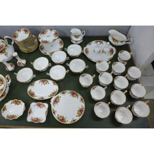 803 - A Royal Albert Old Country Roses dinner service, complete, one plate a/f. Also two rose-pattern bell... 