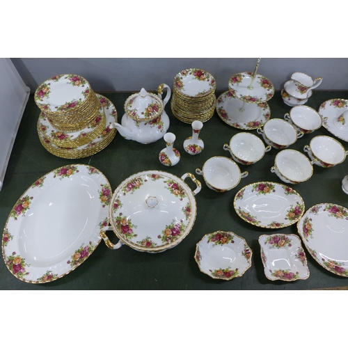 803 - A Royal Albert Old Country Roses dinner service, complete, one plate a/f. Also two rose-pattern bell... 