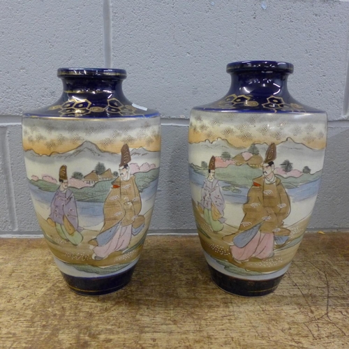 809 - A pair of oriental vases, 31.5cm tall