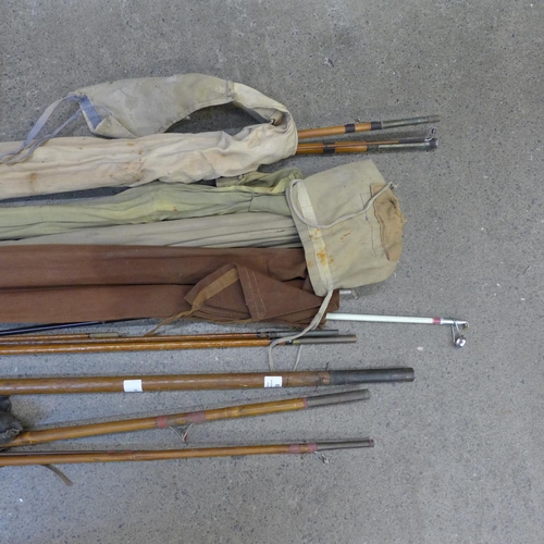 830 - A collection of split cane fishing rods and other antique rods