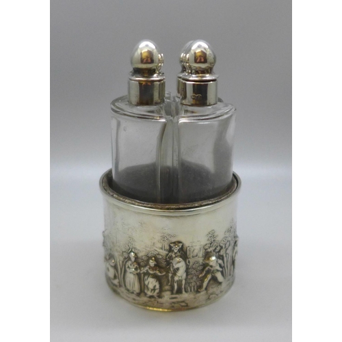 847 - Four silver topped perfume bottles, silver embossed themed holder, 49g, Chester 1903