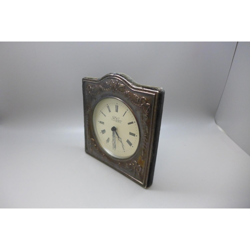 856 - A silver fronted clock