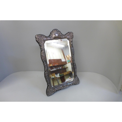 858 - A large silver fronted mirror