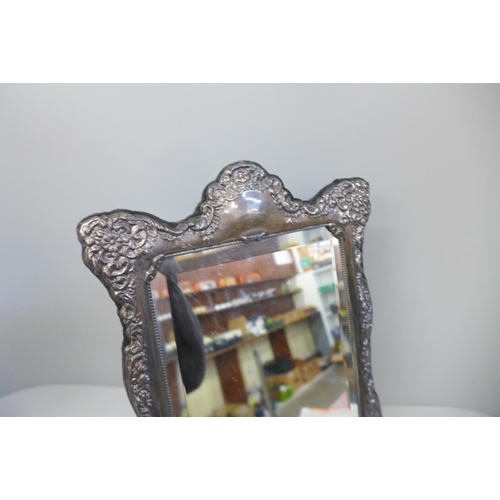 858 - A large silver fronted mirror