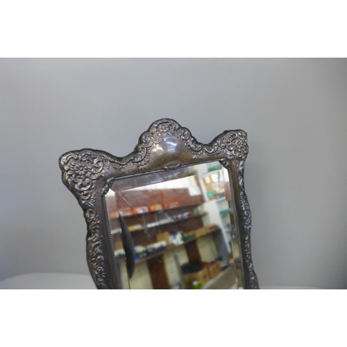 858 - A large silver fronted mirror