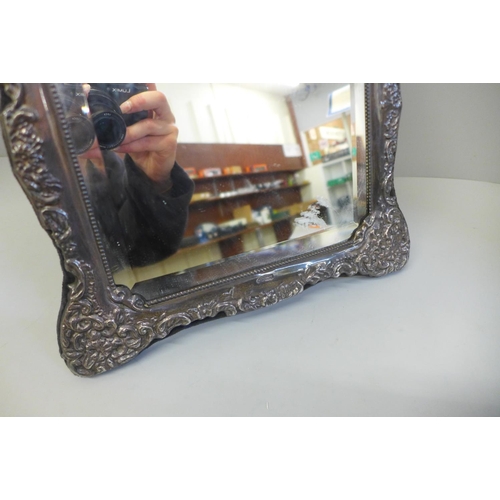 858 - A large silver fronted mirror