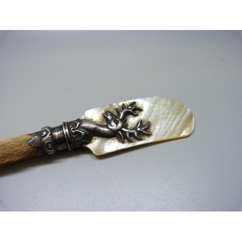 865A - A Scottish silver and mother of pearl caviar spoon with fawn hoof handle