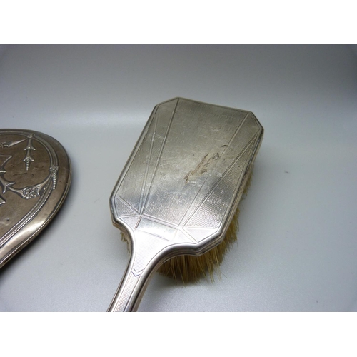 871 - A silver hand mirror and silver brush