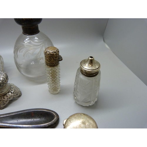 880 - Two silver topped globular scent bottles, silver spoon, silver brush, etc.