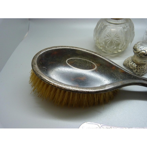 880 - Two silver topped globular scent bottles, silver spoon, silver brush, etc.