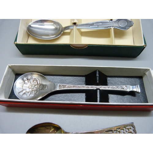 889 - A silver Christmas christening spoon, one other silver spoon and two smaller, 83g