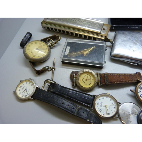 914 - Mixed wristwatches, a jet aircraft pen holder, a Hohner harmonica, etc.