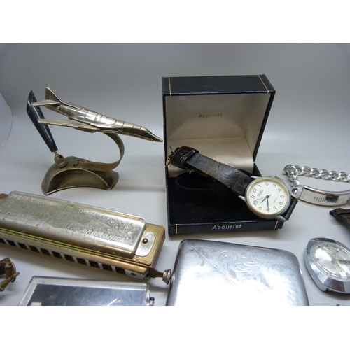 914 - Mixed wristwatches, a jet aircraft pen holder, a Hohner harmonica, etc.