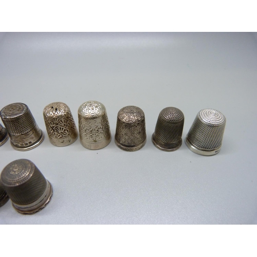 919 - Fourteen silver thimbles