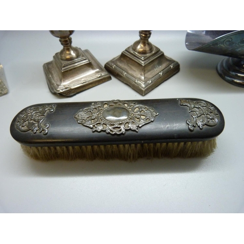 920 - A pair of silver candlesticks, a/f, a brush with applied silver decoration, a metal topped inkwell a... 