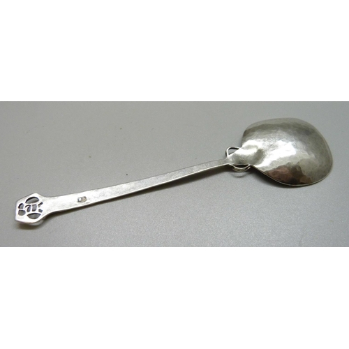 932 - An Arts and Crafts white metal spoon, makers mark L.D., 18g