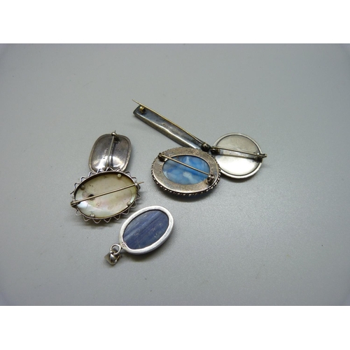 935 - Five silver brooches and a silver pendant