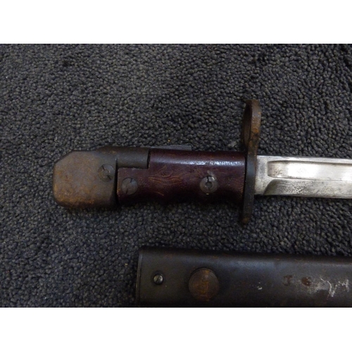 943 - A bayonet and scabbard