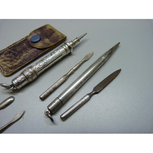 948 - Two Sampson Mordan silver pencils, a silver manicure set and salt spoons