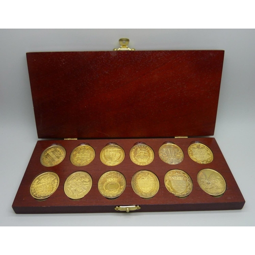 959 - Twelve medallions, The Arms of The Prince and Princess of Wales, boxed and hallmarked, 171g