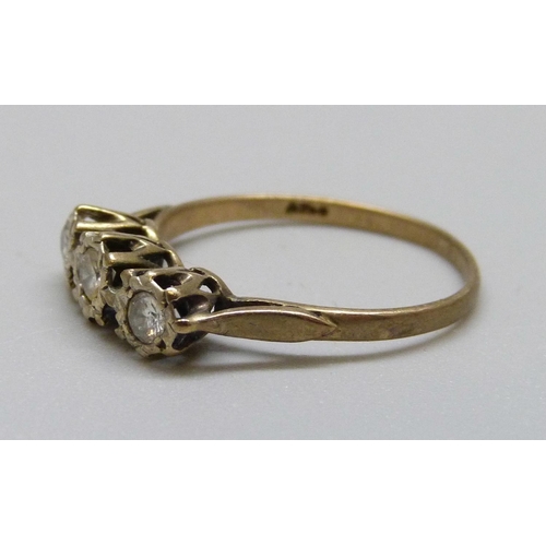 974A - A 9ct gold and three stone ring, 1.6g, N (one stone tests diamond)