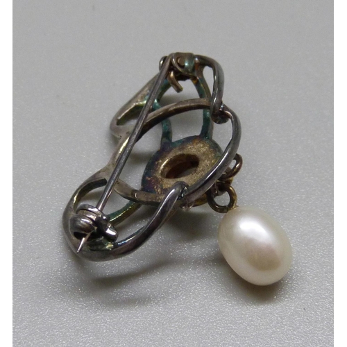 986 - An Art Nouveau white metal brooch, set with moonstone and a pearl drop