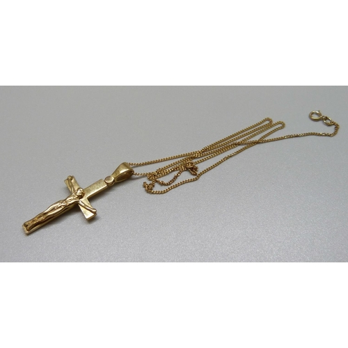 999 - A 9ct gold crucifix and chain, 5.6g