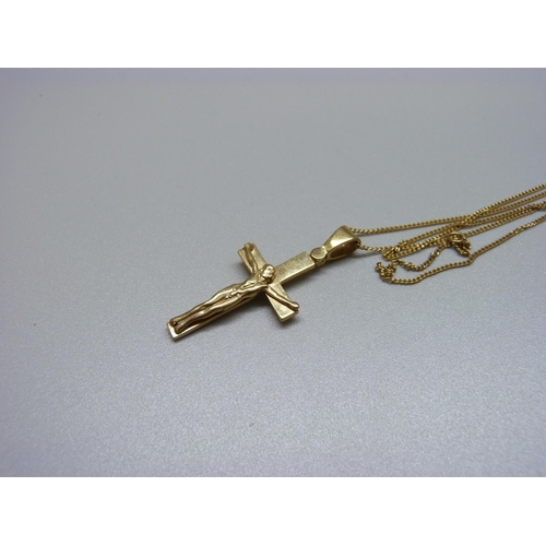 999 - A 9ct gold crucifix and chain, 5.6g