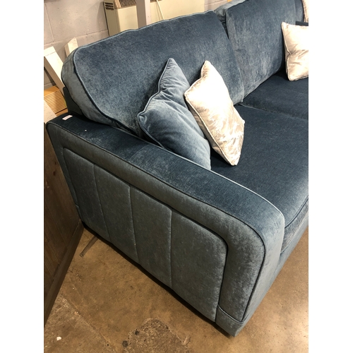 1302 - A steel blue upholstered three seater sofa