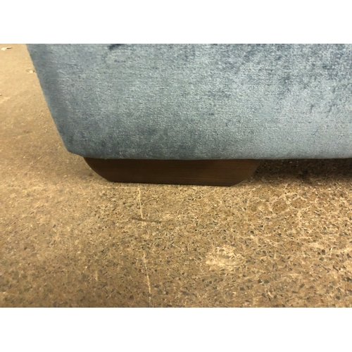 1303 - A steel blue upholstered two seater sofa