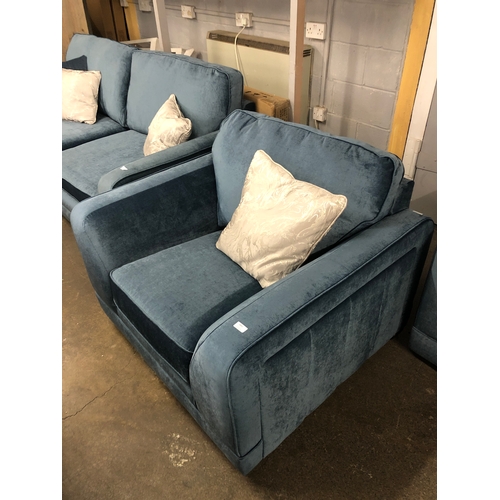 1304 - A steel blue upholstered armchair