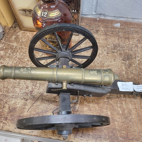 827 - A brass and wood model cannon