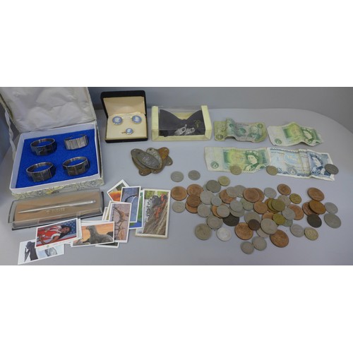 607 - A box of coins and notes, train plaques, etc.